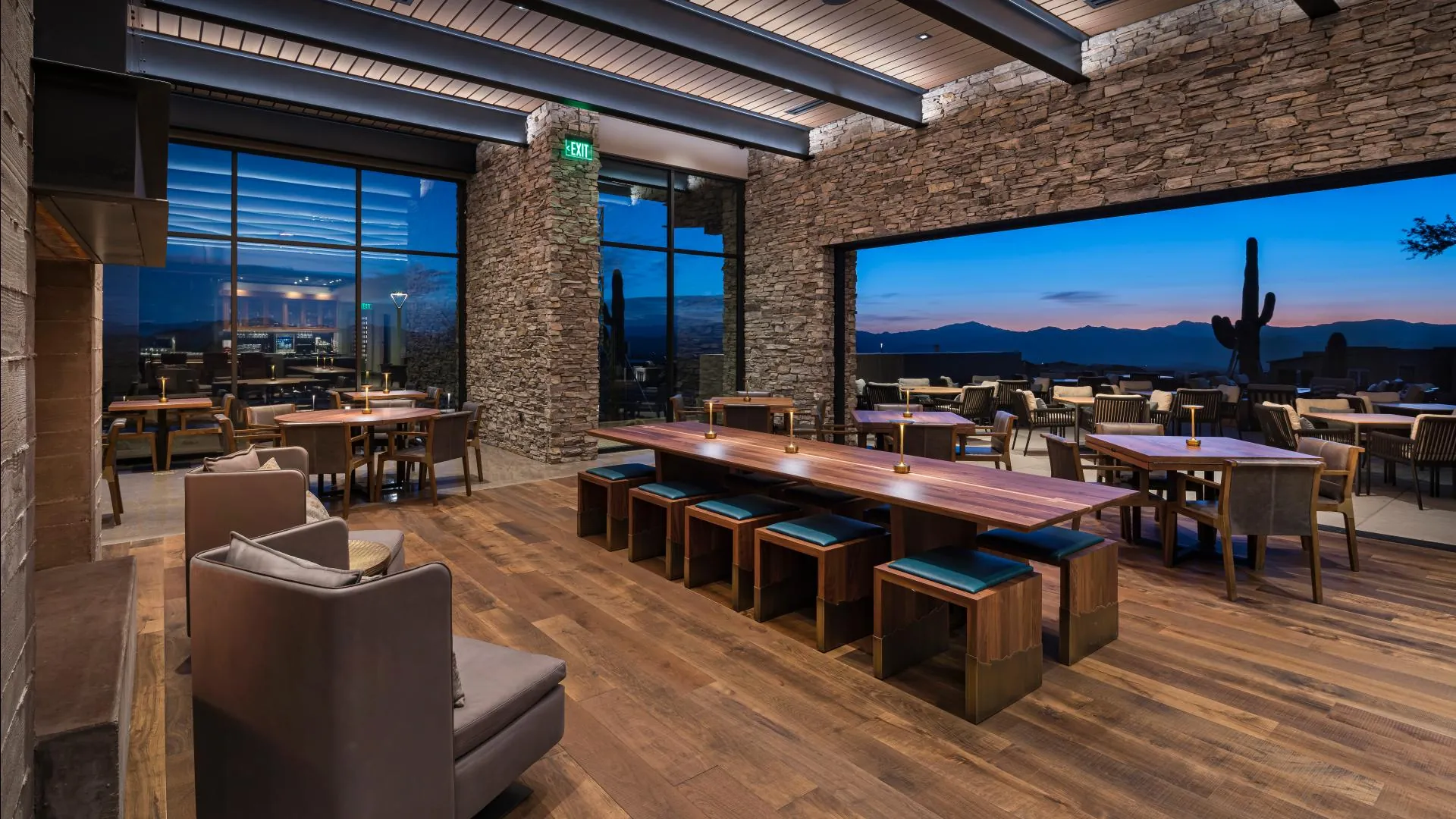 Alterra's dining room at dusk with a long communal table