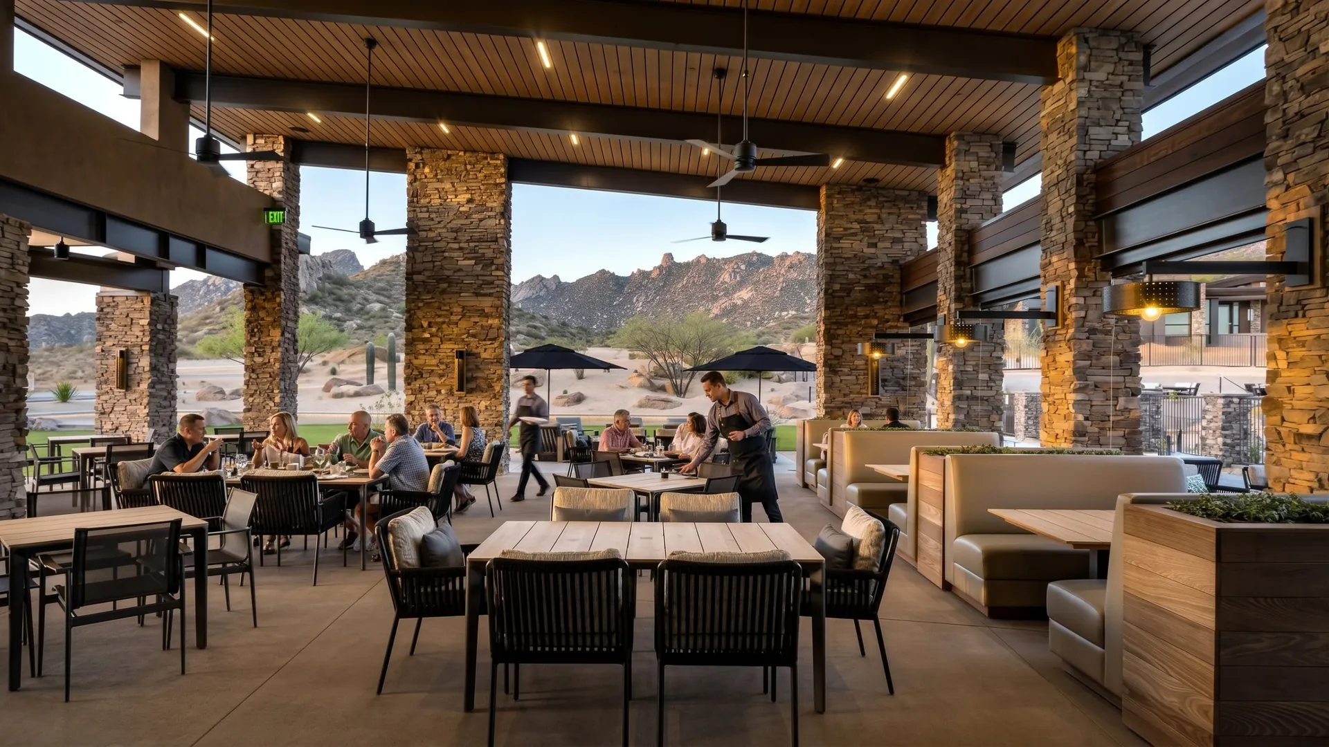 Dinner on Alterra's covered terrace, between the stone columns, with the mountains beyond