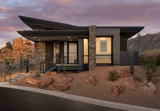 The front of the casita with its stone wall and desert garden